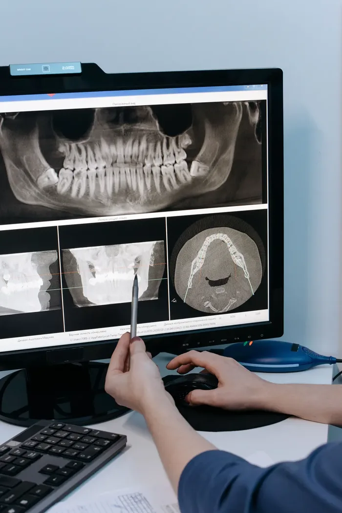Dental imaging being reviewed as part of a comprehensive diagnostic exam